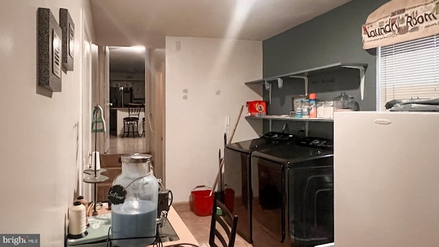 clothes washing area featuring washing machine and clothes dryer