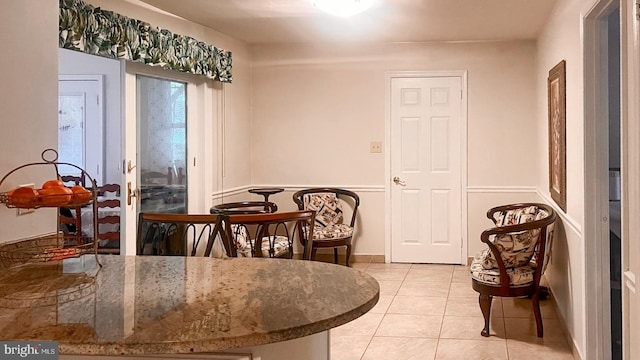 dining space with light tile patterned flooring
