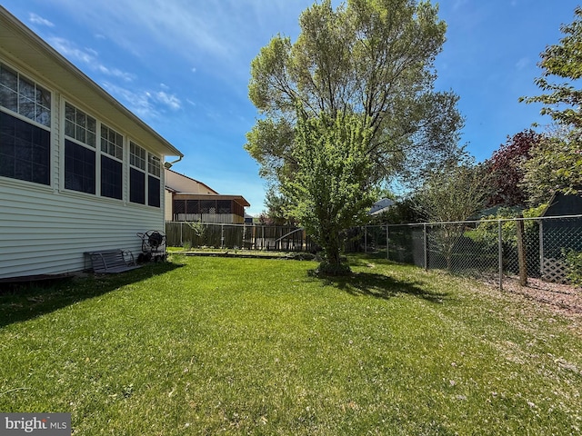 view of yard with a fenced backyard