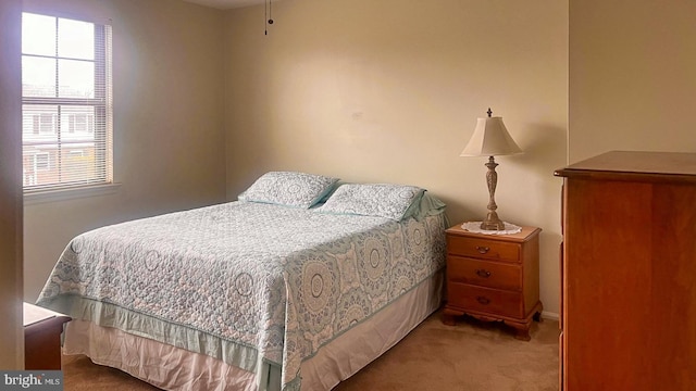carpeted bedroom with baseboards