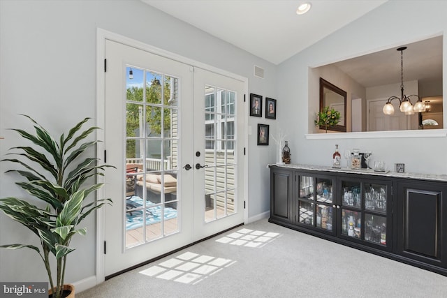 113 Winchester Way, Harleysville, PA 19438 - entryway with lofted ceiling, baseboards, a chandelier, french doors, and carpet flooring