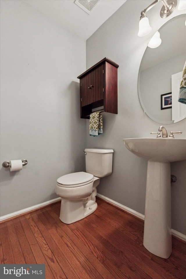 113 Winchester Way, Harleysville, PA 19438 - half bath featuring baseboards, wood finished floors, visible vents, and toilet