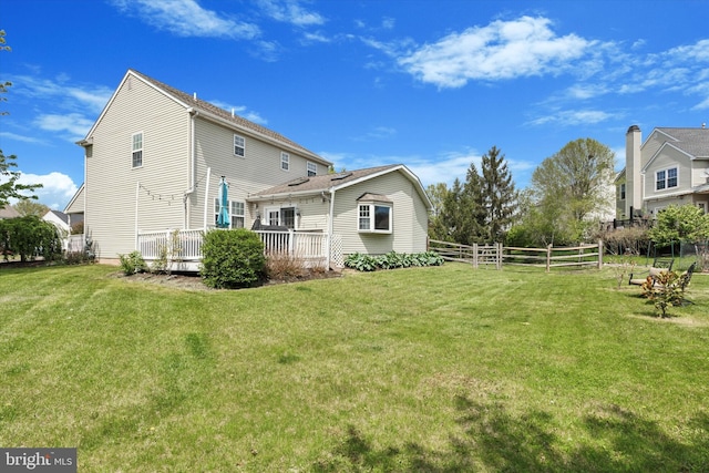 113 Winchester Way, Harleysville, PA 19438 - rear view of house featuring a lawn, a deck, and fence