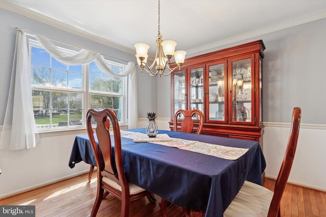 113 Winchester Way, Harleysville, PA 19438 - dining room featuring baseboards, an inviting chandelier, a wealth of natural light, and light wood-style flooring