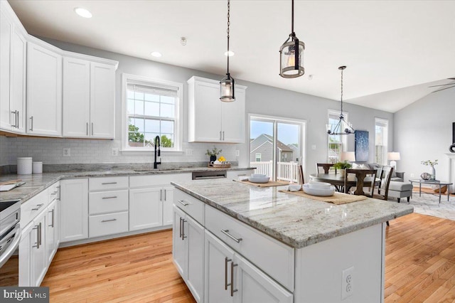 161 Stonecrest Cir, Keedysville, MD 21756 - kitchen with a sink, decorative backsplash, light wood-style flooring, a center island, and recessed lighting