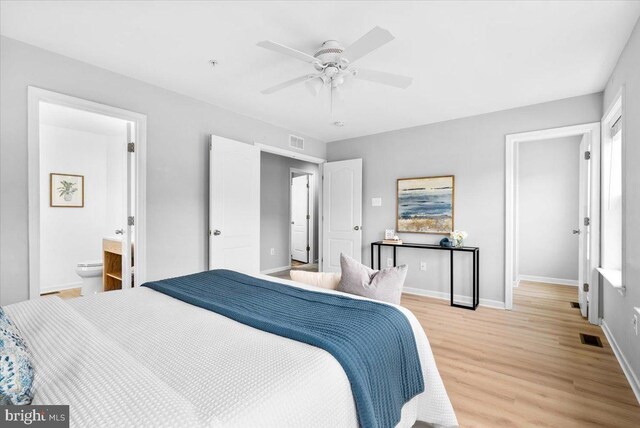 161 Stonecrest Cir, Keedysville, MD 21756 - bedroom featuring light wood-style floors, baseboards, a ceiling fan, and connected bathroom