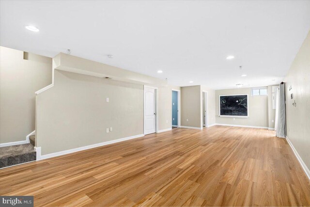 161 Stonecrest Cir, Keedysville, MD 21756 - unfurnished living room featuring stairway, light wood-style flooring, baseboards, and recessed lighting