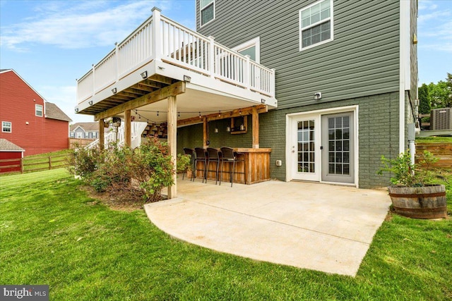 161 Stonecrest Cir, Keedysville, MD 21756 - rear view of house featuring a wooden deck, a patio, and brick siding