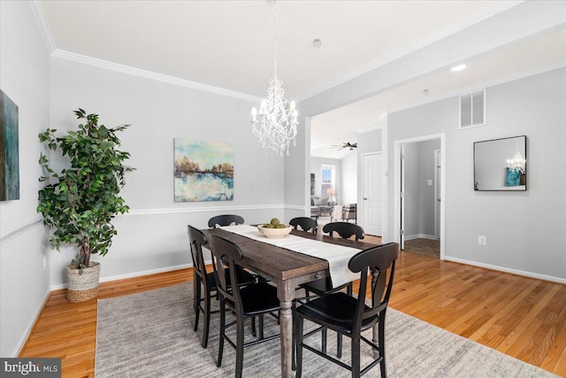161 Stonecrest Cir, Keedysville, MD 21756 - dining area featuring wood finished floors, a chandelier, ornamental molding, and baseboards