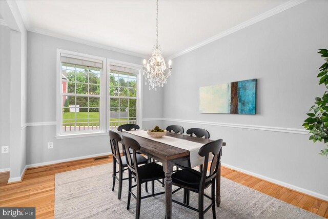 161 Stonecrest Cir, Keedysville, MD 21756 - dining area with a chandelier, ornamental molding, baseboards, and wood finished floors