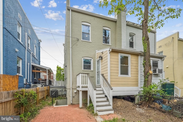 519 Somerset Pl NW, Washington, DC 20011 - view of front of property featuring fence, central AC, and a chimney