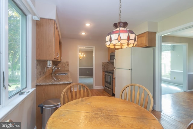 104 Dorado Dr, Delran, NJ 08075 - dining area with recessed lighting, baseboards, a notable chandelier, and a wealth of natural light