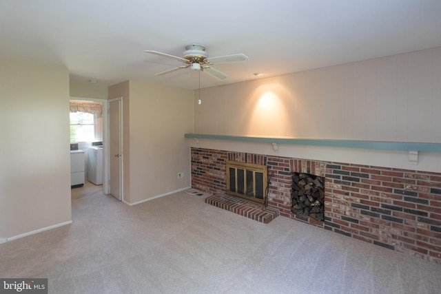 104 Dorado Dr, Delran, NJ 08075 - unfurnished living room with ceiling fan, a brick fireplace, baseboards, washer / dryer, and carpet flooring