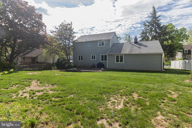 104 Dorado Dr, Delran, NJ 08075 - back of house with a yard, a patio, fence, and a chimney