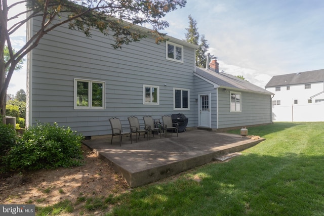 104 Dorado Dr, Delran, NJ 08075 - rear view of property featuring a lawn, a patio, fence, and a chimney