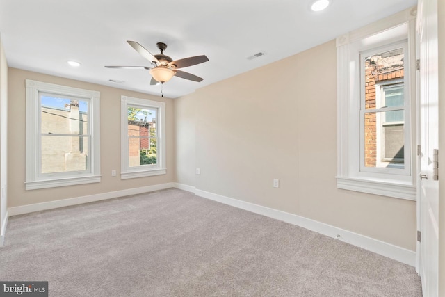 carpeted spare room with a ceiling fan, baseboards, visible vents, and recessed lighting