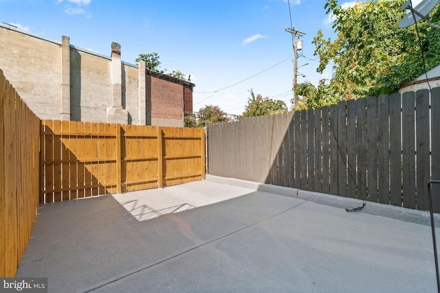 view of patio featuring fence