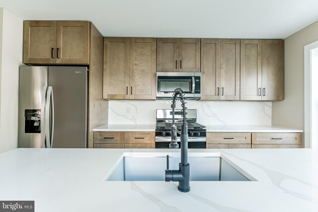 204 Barclay St, Burlington, NJ 08016 - kitchen with light stone counters, appliances with stainless steel finishes, and tasteful backsplash