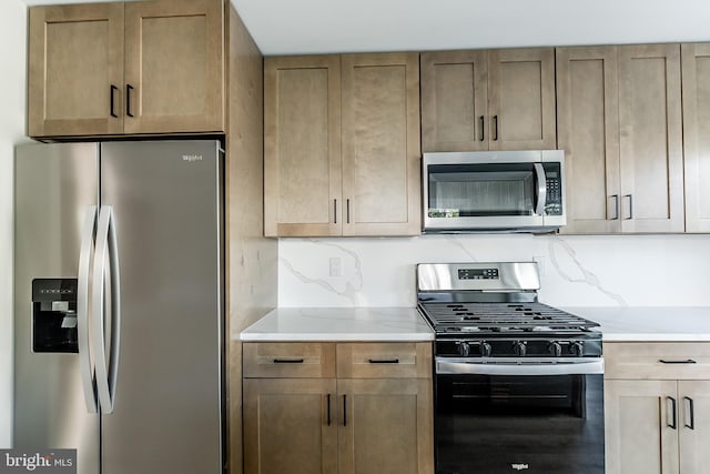 204 Barclay St, Burlington, NJ 08016 - kitchen with appliances with stainless steel finishes and light stone countertops