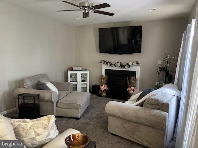 carpeted living room with a fireplace with flush hearth, a ceiling fan, and recessed lighting
