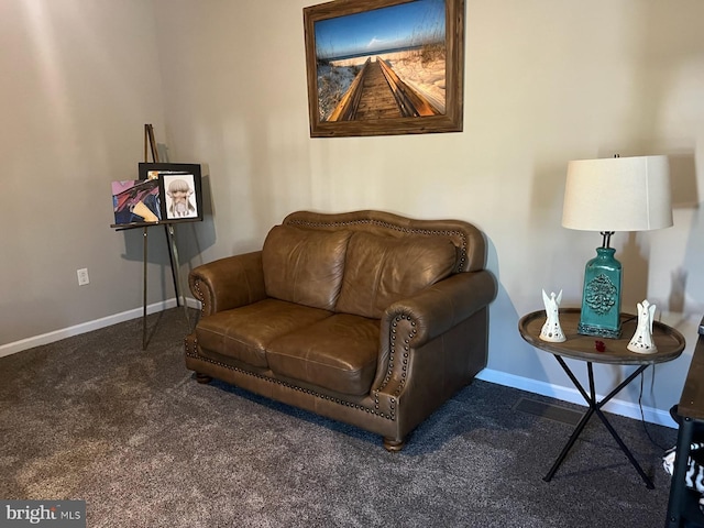 sitting room featuring carpet flooring and baseboards