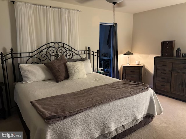 carpeted bedroom featuring a ceiling fan