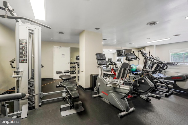 exercise room featuring visible vents