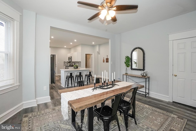dining space with a ceiling fan, baseboards, recessed lighting, and dark wood-type flooring