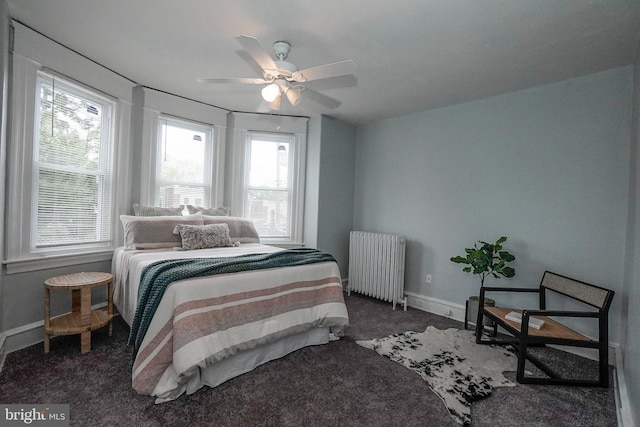 bedroom with radiator, baseboards, carpet, and ceiling fan