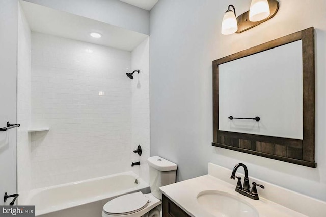 bathroom with vanity, bathtub / shower combination, and toilet