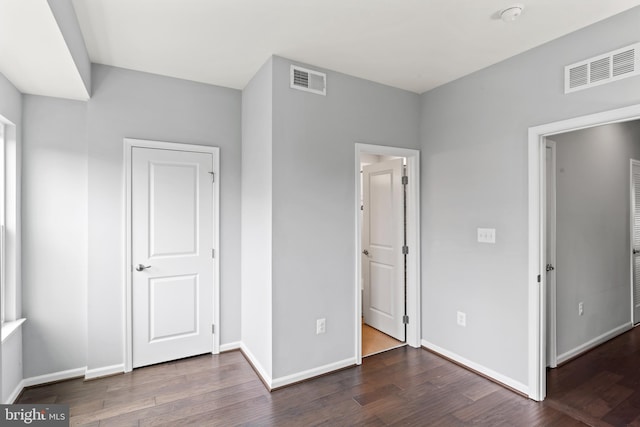 6101 Enquirer St, Hyattsville, MD 20782 - unfurnished bedroom featuring wood finished floors and baseboards
