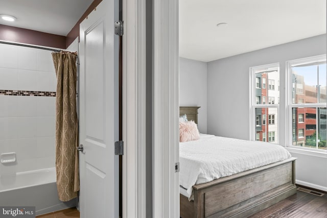 6101 Enquirer St, Hyattsville, MD 20782 - bedroom with dark wood-type flooring and baseboards