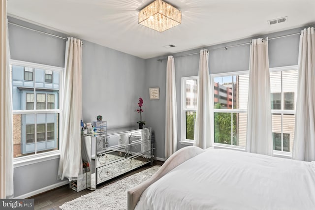 6101 Enquirer St, Hyattsville, MD 20782 - bedroom with wood finished floors, baseboards, and a chandelier