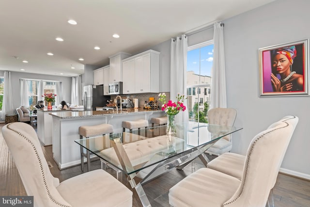 6101 Enquirer St, Hyattsville, MD 20782 - dining space with recessed lighting, wood finished floors, and baseboards