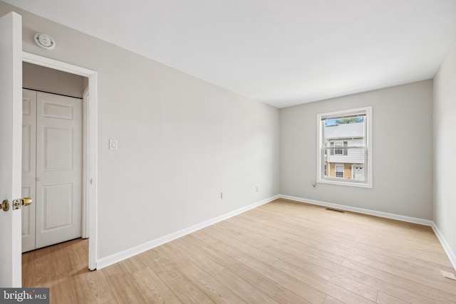 565 W Diamond Ave Unit 27, Gaithersburg, MD 20877 - unfurnished room featuring light wood-style floors, baseboards, and a smoke detector