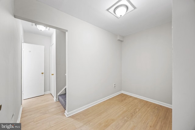 565 W Diamond Ave Unit 27, Gaithersburg, MD 20877 - empty room featuring light wood-type flooring, baseboards, and stairway