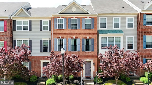 multi unit property featuring brick siding