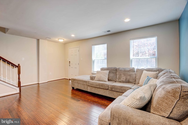 living area with stairway, wood-type flooring, recessed lighting, and baseboards