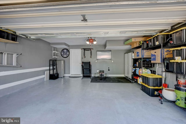 garage featuring baseboards