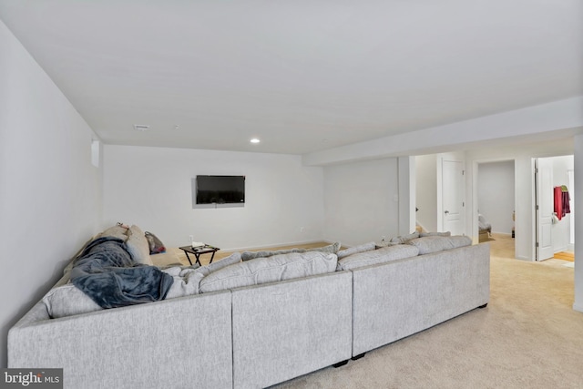 living area with light carpet and recessed lighting