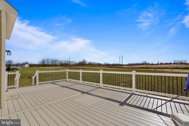 wooden terrace with a rural view