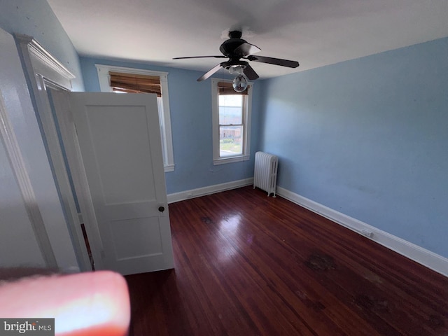 4702 Kernwood Ave, Baltimore, MD 21212 - unfurnished bedroom featuring radiator heating unit, baseboards, wood finished floors, and a ceiling fan