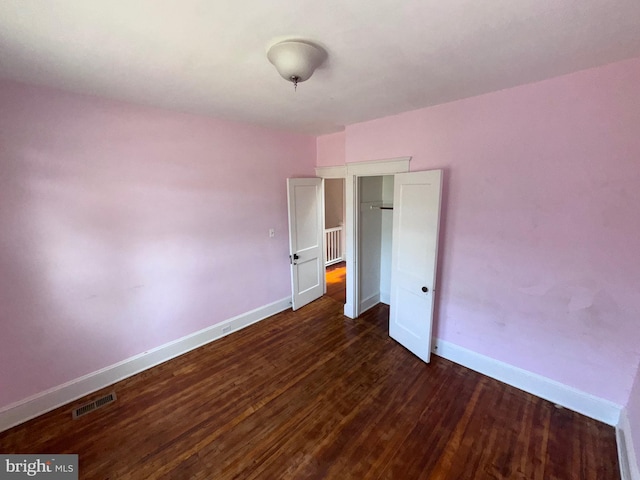4702 Kernwood Ave, Baltimore, MD 21212 - unfurnished bedroom with baseboards and dark wood finished floors