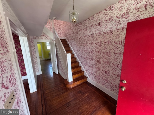 4702 Kernwood Ave, Baltimore, MD 21212 - stairs featuring wallpapered walls, wood finished floors, baseboards, and a chandelier