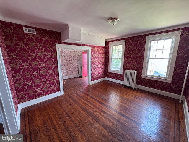 4702 Kernwood Ave, Baltimore, MD 21212 - empty room with radiator, wood finished floors, baseboards, and crown molding