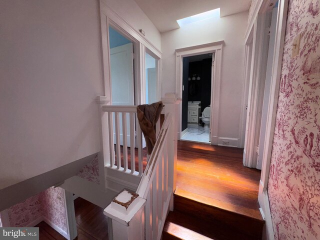 4702 Kernwood Ave, Baltimore, MD 21212 - stairs with wood finished floors and a skylight