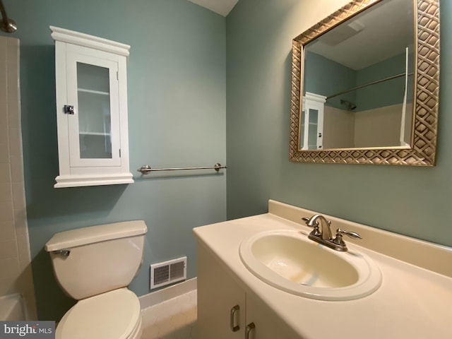 bathroom featuring vanity, toilet, a shower, and visible vents