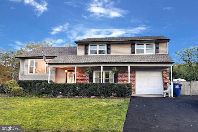 48 Evergreen Ln, Burlington, NJ 08016 - view of front of home featuring a front lawn, brick siding, a shingled roof, an attached garage, and driveway
