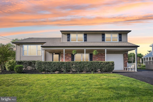 48 Evergreen Ln, Burlington, NJ 08016 - view of front of house featuring brick siding, an attached garage, a lawn, and a shingled roof