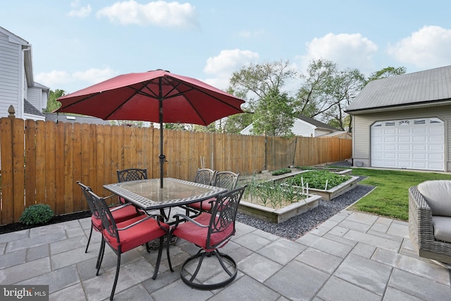 48 Evergreen Ln, Burlington, NJ 08016 - view of patio featuring fence private yard, outdoor dining area, and a garden